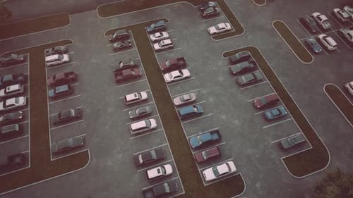 Aerial View of a Nearly Empty Parking Lot During Late Afternoon in Autumn
