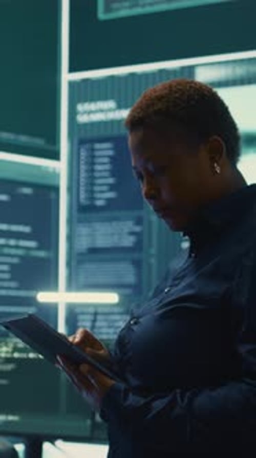 Vertical Video Governmental Hackers Working on Computer Network in High Tech Office