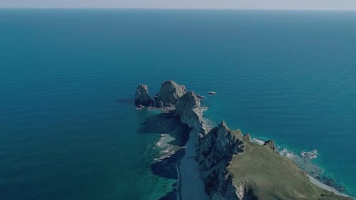 Aerial Panoramic View of Cliffs and Huge Rocks at Seaside and Waves Crashing to the Coast Beautiful