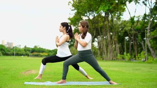 Woman Practicing Yoga in Park