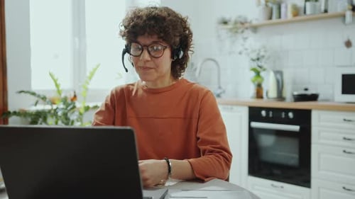 Woman in Kitchen on Video Conference Call