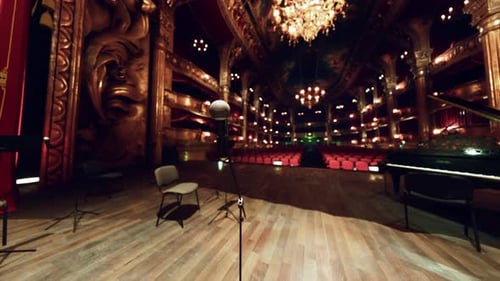 Ornate Theater Stage with Microphone and Piano Before a Performance