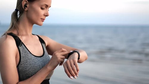 Fitness Woman Jogging Running Cardio Training Use Smartwatch Sunset Summer Beach Sea Waves Closeup