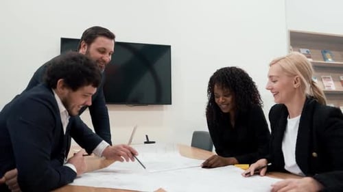 Team Analyzes Document Together in Office