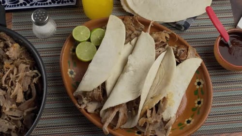 Delicious Tacos with Shredded Meat and Limes