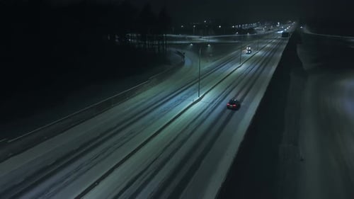 Solitary Vehicle Traverses Bright City Streets Lone Sedan Cruises Under Illuminated Sky in Urban