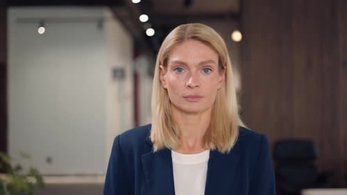 Caucasian Female with Beautiful Facial Features Standing in Business Center