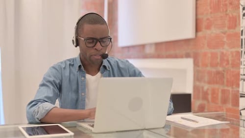 Online Chat by African Man in Call Center, Customer Service