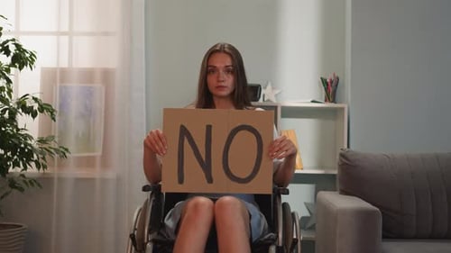 Woman in Wheelchair Holds No Sign