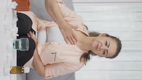 Vertical video of Woman with chest pain.