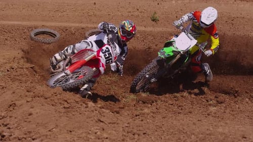 Motocross Racers Going Around Corner (fully Released)