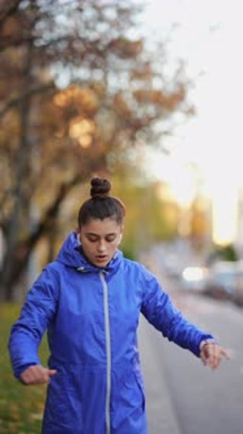 Woman Stretching Before Workout in Urban Environment