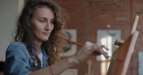 Woman Painting on Canvas at Art Studio