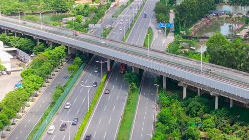 Aerial View of Highway Overpass with Cars and Trucks