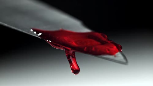 Blood Dripping From the Knife Blade Filmed on a Highspeed Camera at 1000 Fps