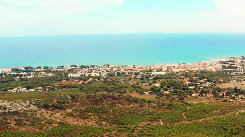 Beautiful Summer Scenery By The Coastline Of A Beach Resort On A Sunny Day. wide aerial