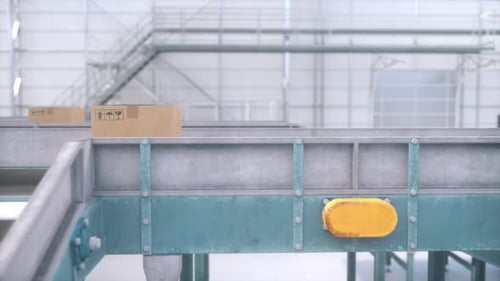 Modern logistics warehouse with working conveyor belt system. Cardboard boxes on a conveyor belt