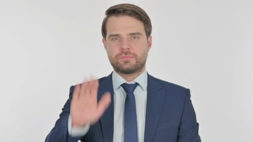 Man in Suit Says Stop with Hand