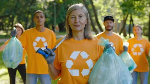Portrait of the Multiethnic Group of the Eco Activists Standing After Cleaning the Forest From the