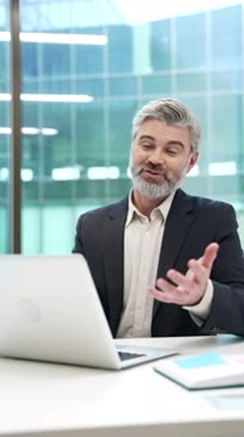 Man talking on a video call in office