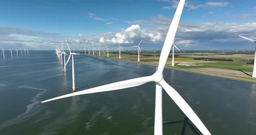 Wind farm in the sea. Clean energy production. Video background. Technology and innovation.