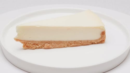 Cheesecake Slice on White Plate, Close Up