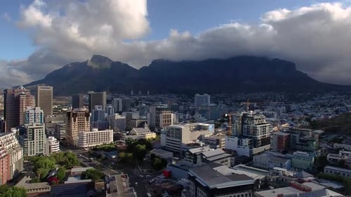 Epic Shot of Table Mountain in Cape Town with City and Clouds
