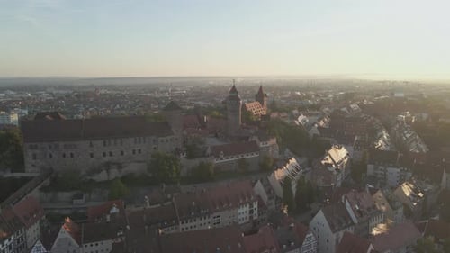 Flying toward the Imperial Castle in Nuremberg Germany at dusk