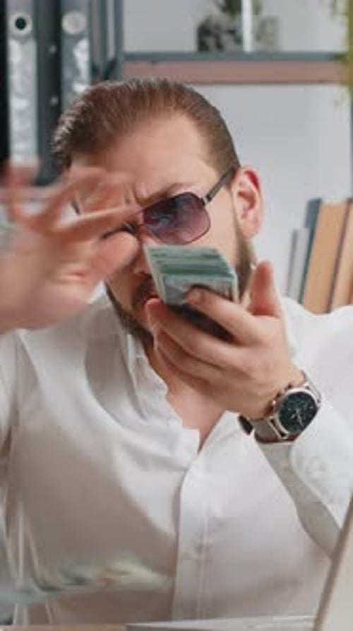 Cheerful Rich Business Man Working on Office Laptop Wasting Throwing Money to Camera Profit Win
