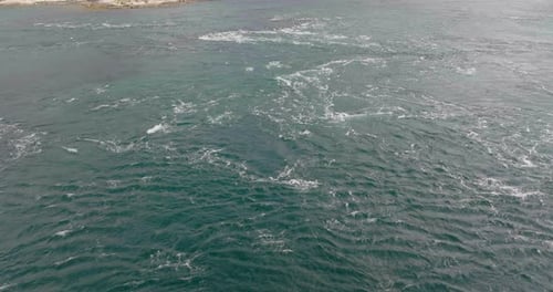 Strong Tidal Current In The Ocean In Northern Norway. aerial drone