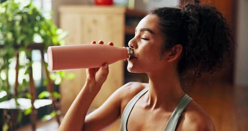 Home, woman and fitness with drinking water for wellness, hydration or nutrition for healthy body