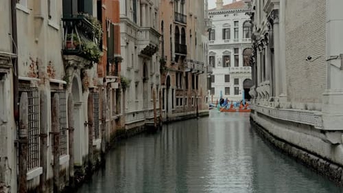 Gondolas Gliding Past Venice's Historic Buildings