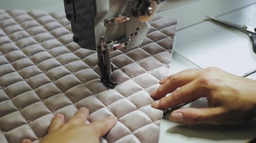 Woman's Hands Sewing Fabric on the Automatic Sewing Machine