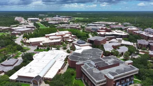 University of Central Florida campus, featuring modern academic buildings, lush green spaces, and ex