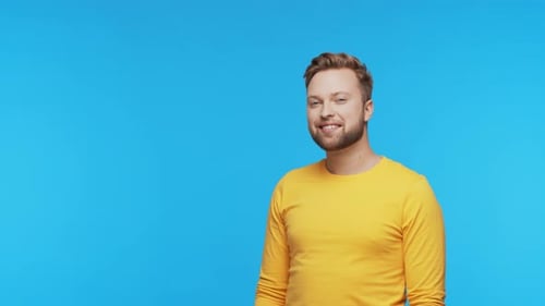 Expressive Young Man Over Vibrant Background Studio Portrait of Handsome Person