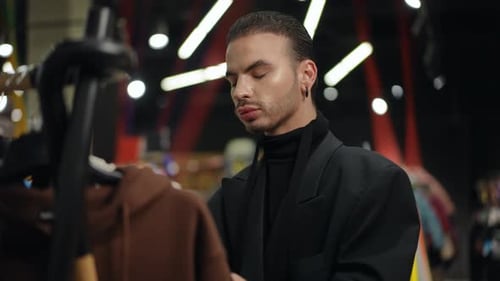 A Fashionable Male Engaging in Shopping for Contemporary and Trendy Apparel Options