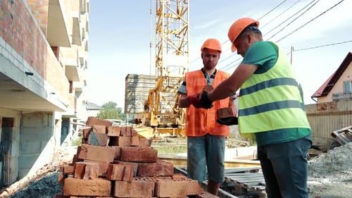 Builders Are Loading Bricks