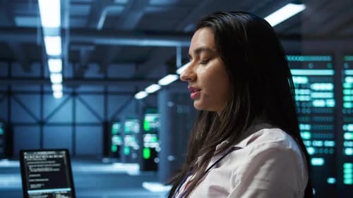 Programmer in Data Center Typing on Computer Keyboard