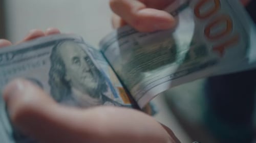 Counting Stack of Cash Money