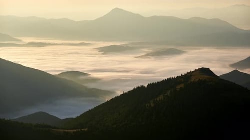 Mountainous Hilly Landscapeinverted Clouds in the Valley Landscape After Sunrise