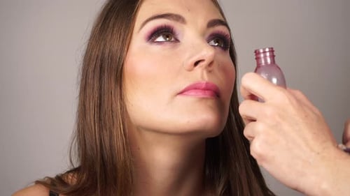 Makeup Artist Touching Up Model Makeup