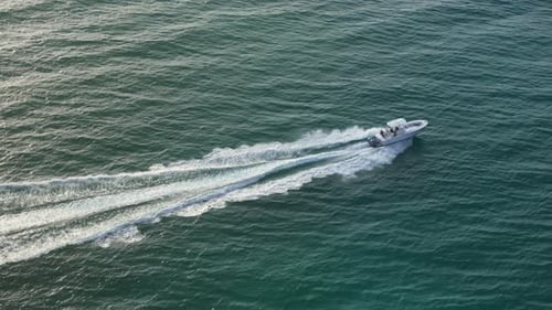 Aerial View of a Fastsailing Boat at Sunrise in Floridas Nature