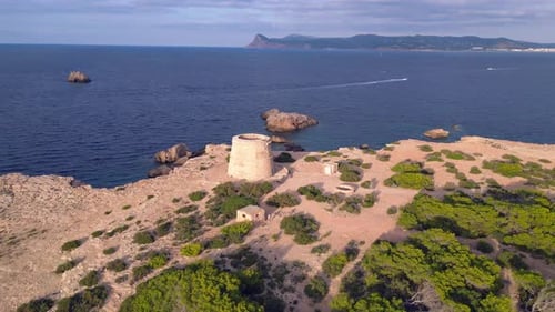 mediterranean coastal sunset ancient historic tower. Breathtaking aerial top view flight speed ramp
