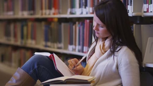 College Student Studying In Library