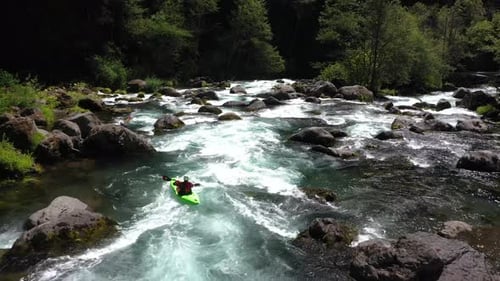 Aerial view of whitewater kayaker running class IV rapids on the Mill Creek section of the Rogue Riv