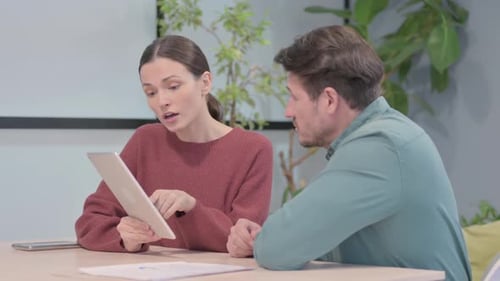 Business People Working on Tablet in Office