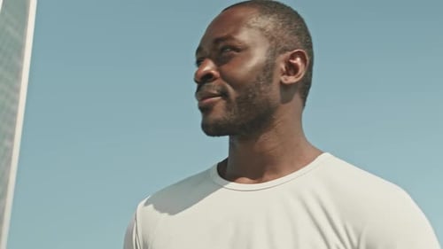 Man Drinking Water After Exercising in the City