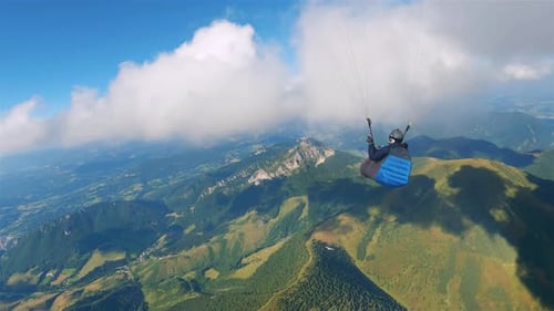 The Beauty of Paragliding Flying in Clouds Sky above Alps Mountains Landscape, Freedom Adrenaline