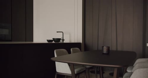 Modern Minimalist Kitchen and Dining Area with Dark Wood Furnishings