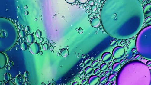 Colorful Oil Bubbles Moving On A Water Surface 077